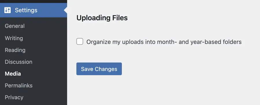 Settings page in WordPress under Media with checkbox "Organize my uploads into month- and year based folders"